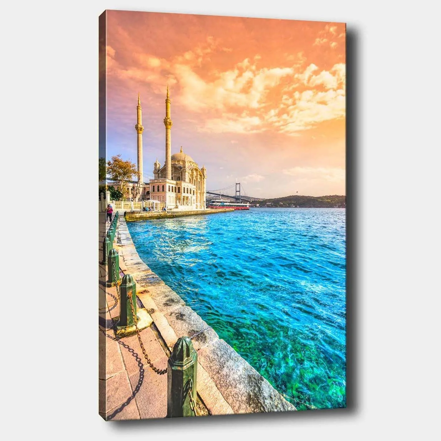 Canvastavla 70x100 cm - Vacker vy av en moské vid vattnet med en bro i bakgrunden under en färgsprakande himmel - Blå / Orange / Beige