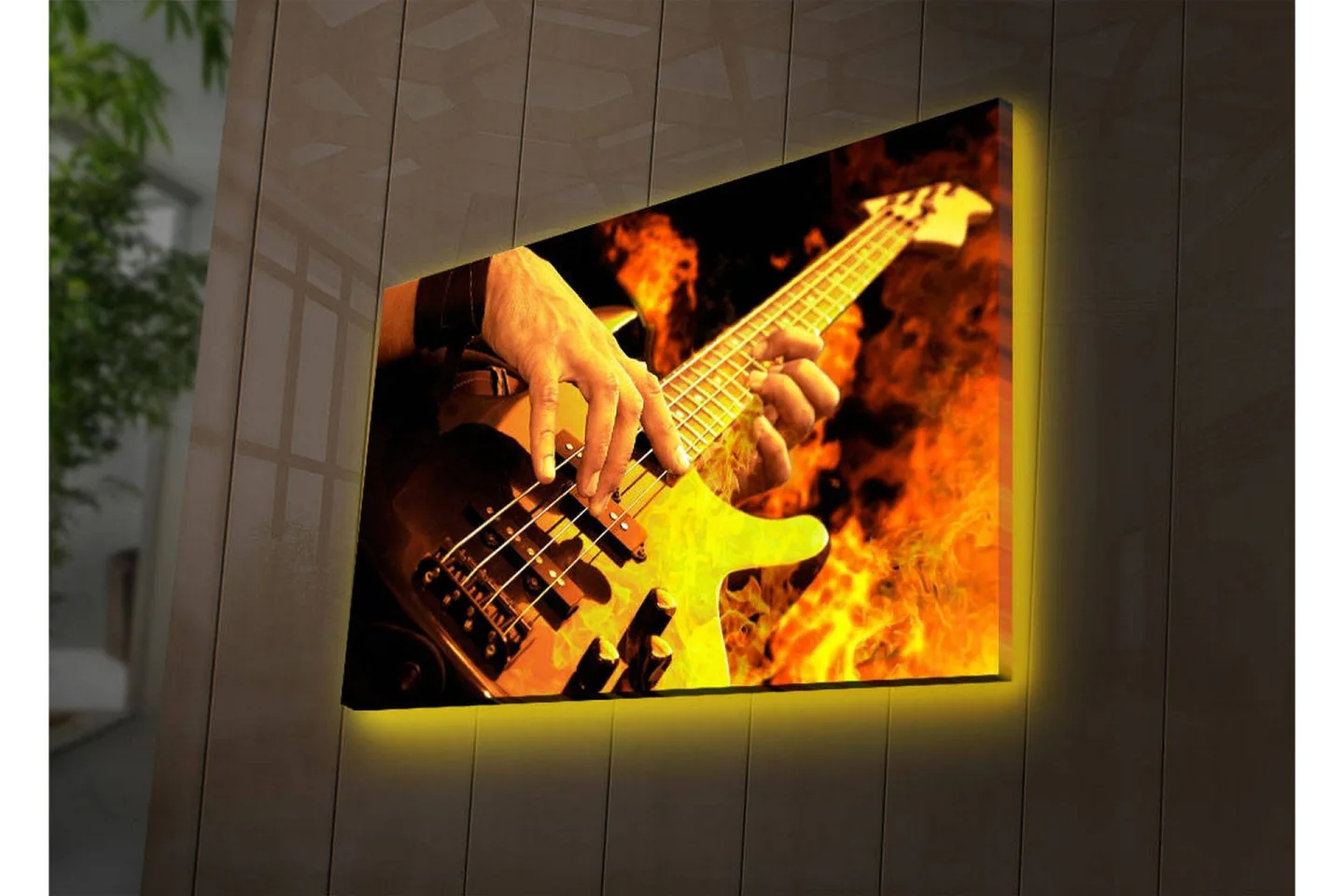 Canvastavla med LED-belysning 45x70 cm - Gitarrist som spelar en elbas omgiven av eldiga flammor - Orange / Svart / Gult