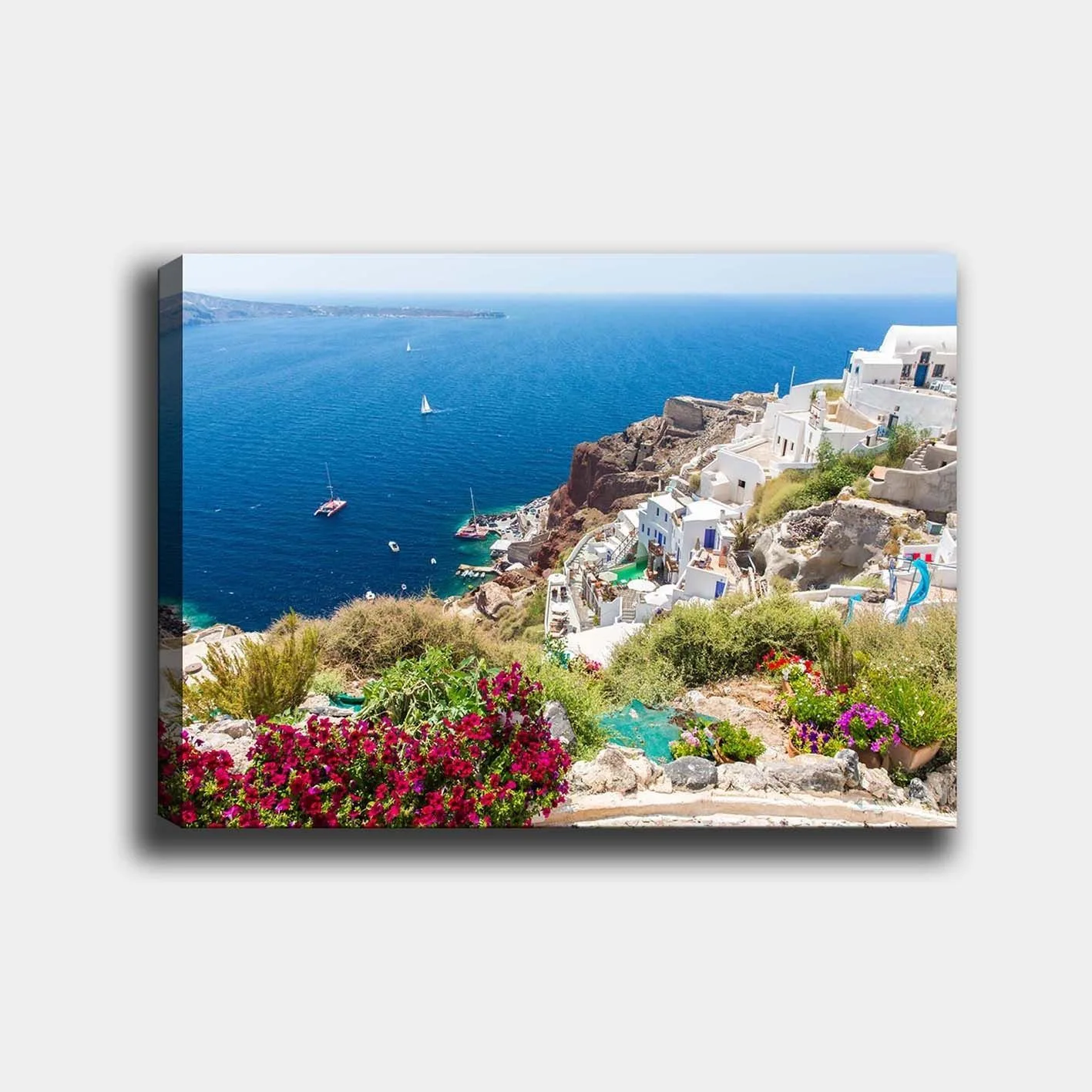 Canvastavla 70x100 cm - Vacker utsikt över Santorini med vita hus och blommor som pryder klipporna vid havet - Blå / Vit / Grön