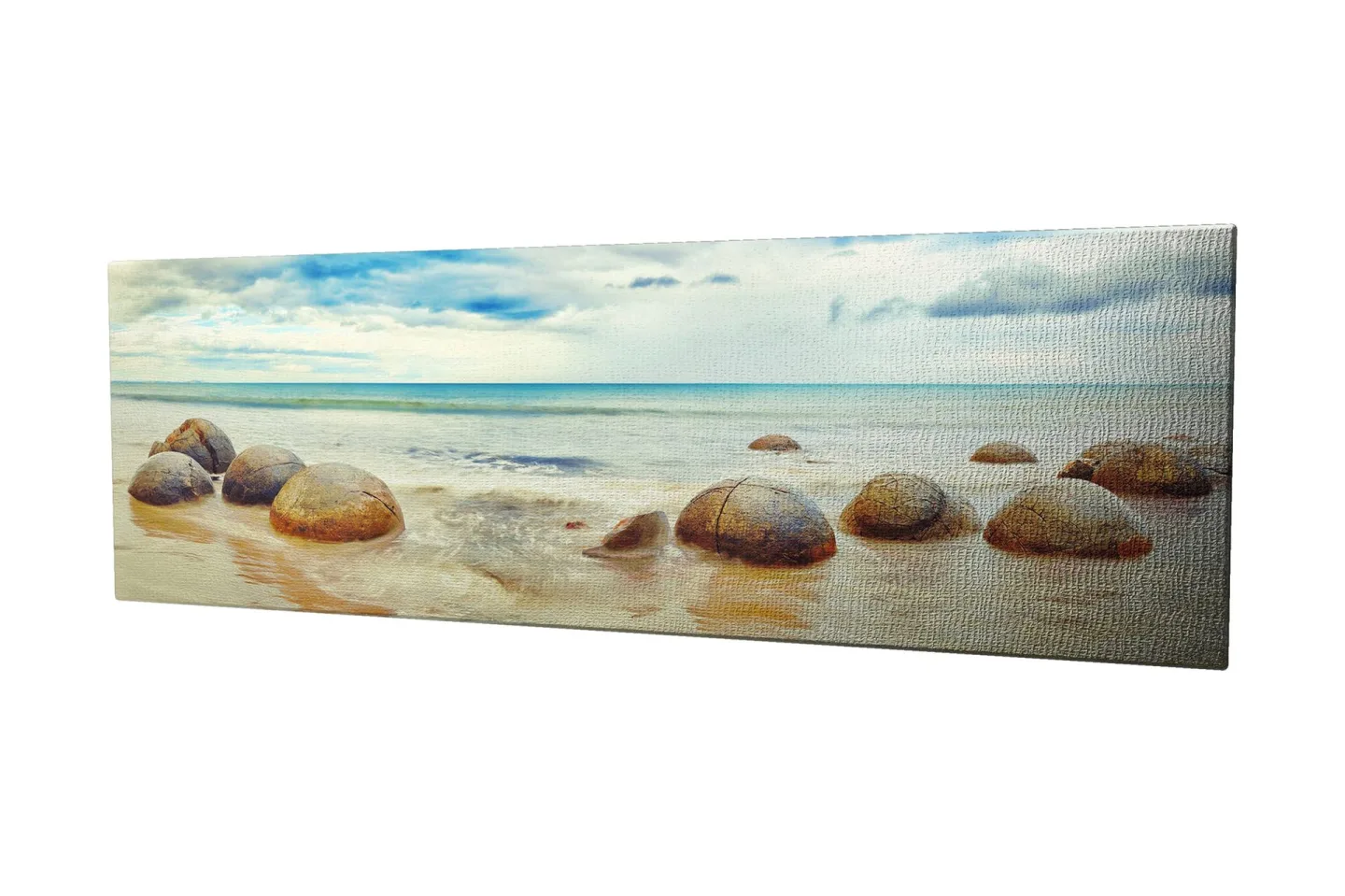 Canvastavla 80x30 cm - Runda stenar vid en strand med hav och himmel i bakgrunden - Blå / Beige / Grå