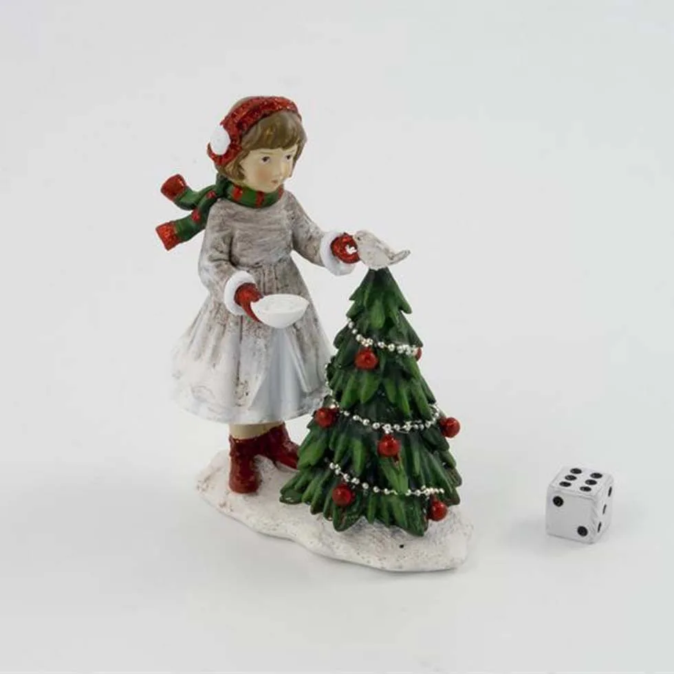 Juldekoration flicka som matar fågel